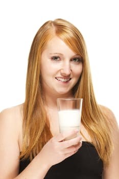 redhead woman with a glass of milk on white background