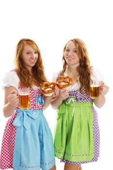 two bavarian dressed girls with pretzels and beer on white background