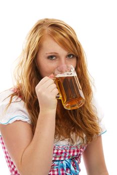 pretty bavarian girl drinking beer on white background