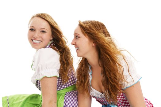 two bavarian girls looking on white background