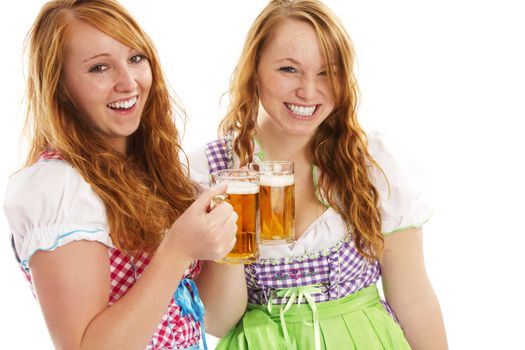 two happy bavarian girls with beer on white background