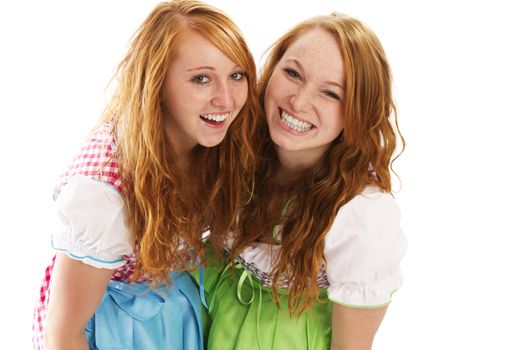 two happy bavarian redhead women on white background