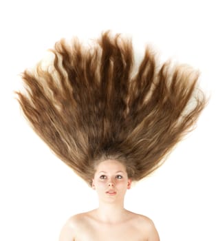 Healthy beautiful long hair closeup in motion created by wind. Isolated on white