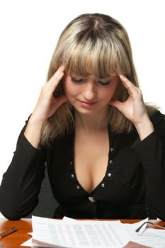 Headache. The business woman on the workplace tired of work. It is isolated on the white background.