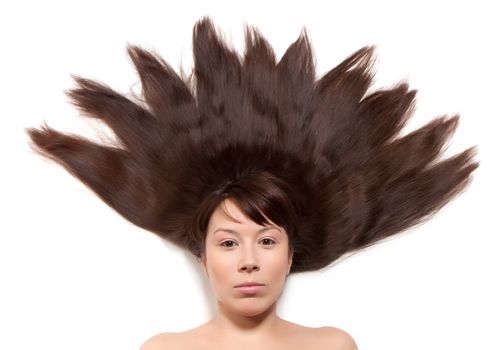 woman with long brown hair lying on the floor