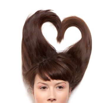 
woman with long hair lying in the form of heart