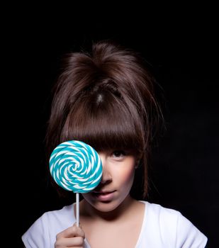 young woman with lolipop, black background