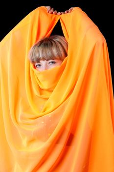 The woman close up. Face partially covered pareo.