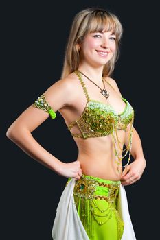The woman in east dancing suit. Isolated on black background