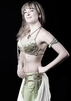 The woman in east dancing suit. Isolated on black background