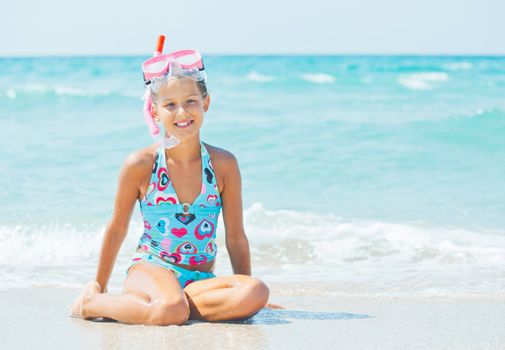 Portrait of a cute girl wearing a mask for diving background of the sea