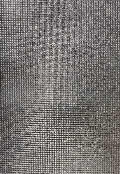 Texture of metal. Detailed finely scaly metal surface
