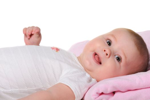 The baby lays. Age of 8 months. It is isolated on a white background