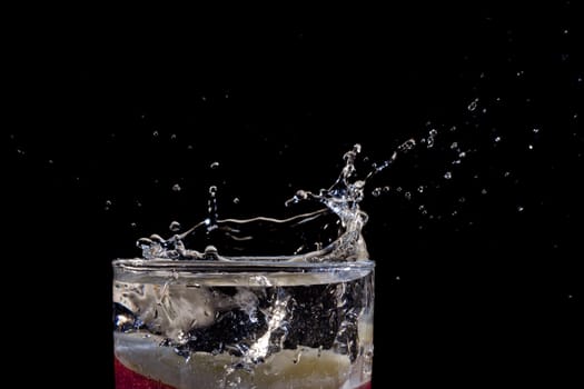 The motion of a slice of apple splashing into a glass of water