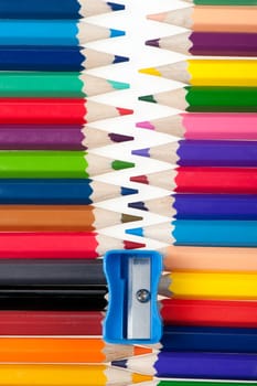 Fastener from color pencils. Abstract concept