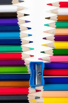Fastener from color pencils. Abstract concept