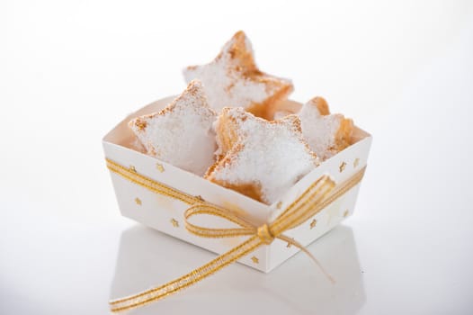 Christmas cookies in a box with gold stars