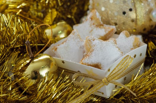 Christmas cookies in a box with gold stars