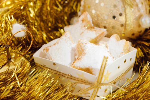 Christmas cookies in a box with gold stars