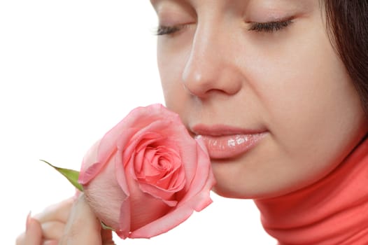 The woman with a rose closeup. Isolated on white