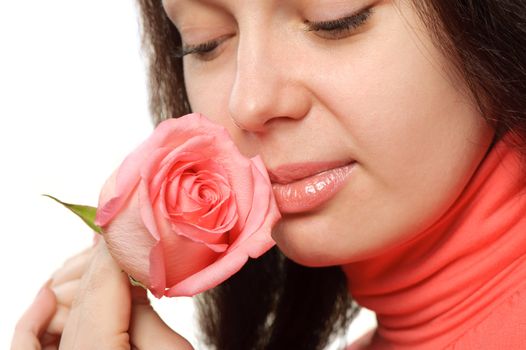 The woman with a rose closeup. Isolated on white