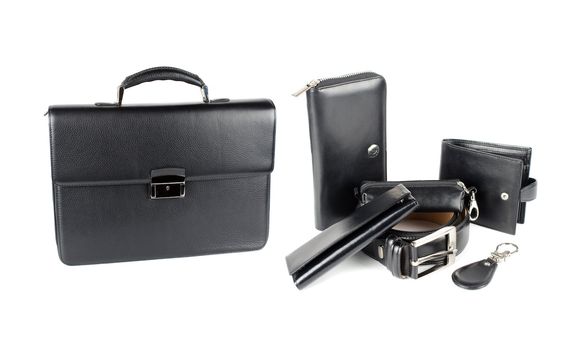 Leather male bag with accessories on a white