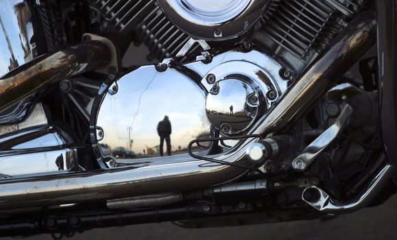 Part of a motorcycle with reflections
