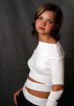 Portrait of the beautiful girl on a dark background