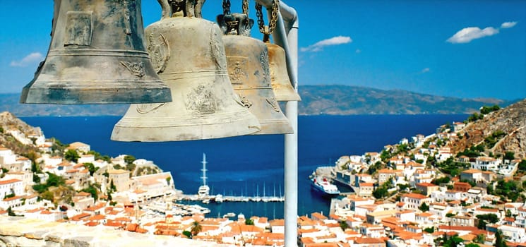 Four big bells over the town and blue sea