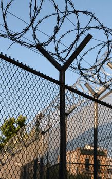 jail fence with barbed wires for protection