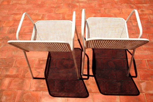 two chairs for a sunbath on the terrace, nice shadows