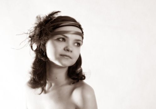 Portrait of a young girl in hat in studio