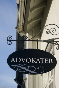 A Norwegian sign that says advokater (lawyers). Could be used to fill in whatever one needs, as the sign is quite uniform black.