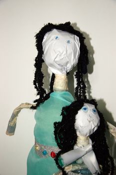two dolls made from a plastic bottles