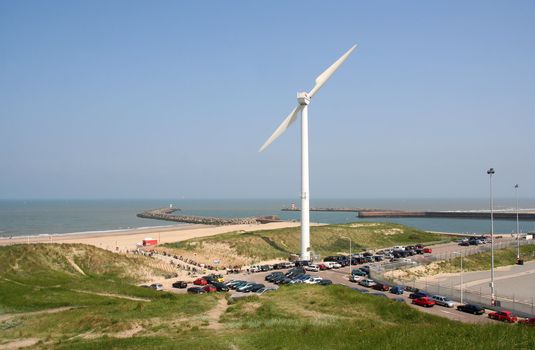 Wind turbine in the dunes, with north sea in the background