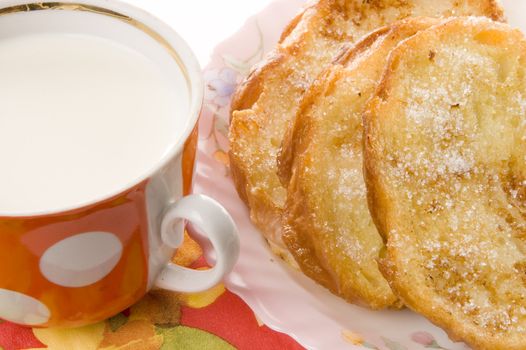 Toast and milk on a china plate