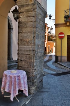 Italian alley with bar table