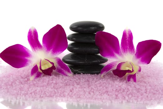 Aromatic bath salt, healing pebbles and exotic orchids