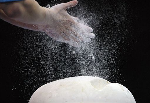 Close-up of hands of the gymnast in talc
