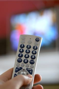A remote control in action - shallow depth of field, with focus on the remote.
