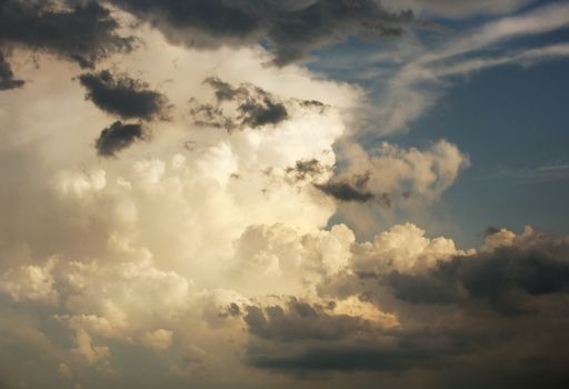 The image of white clouds on a background of the dark blue sky