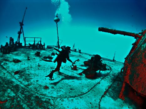 Fantasy Wreck Diver exploring the Deck of a Sunken Ship