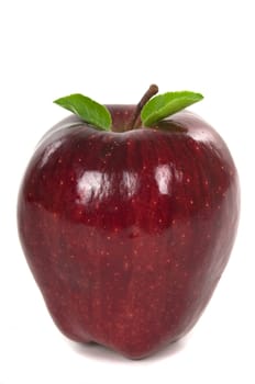 Organic red apple with leaves