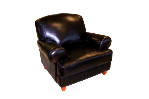 A black leather armchair isolated over white - clipping path included