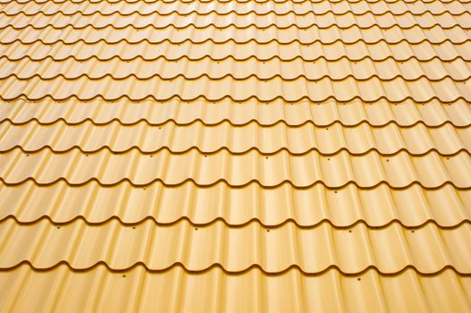 a roof is covered a yellow wavy metal, background