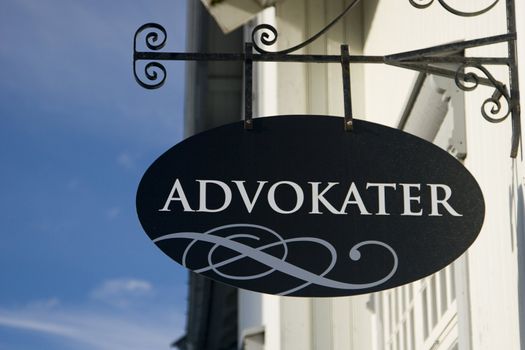 A Norwegian sign that says advokater (lawyers). Could be used to fill in whatever one needs, as the sign is quite uniform black.