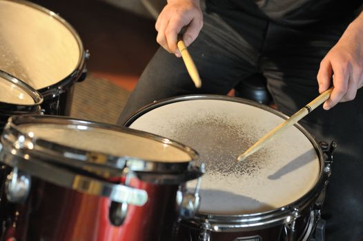 The drummer in action. A photo close up process play on a musical instrument