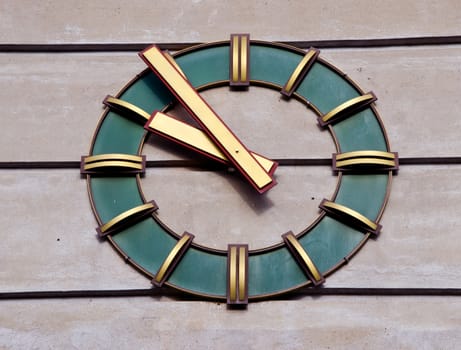 Modernistic clock on the wall of industrial building. Time passing.