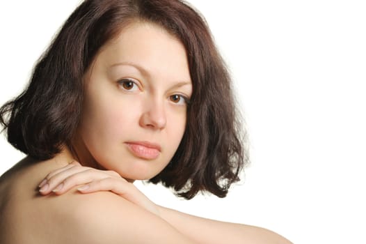 The beautiful young woman embracing hands. Natural beauty. It is isolated on a white background