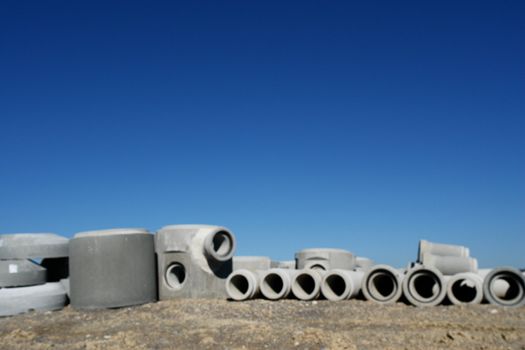 concrete pipes on a building site on a sunny day